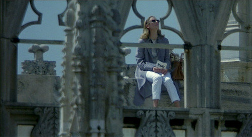 woman sitting on the cathedral